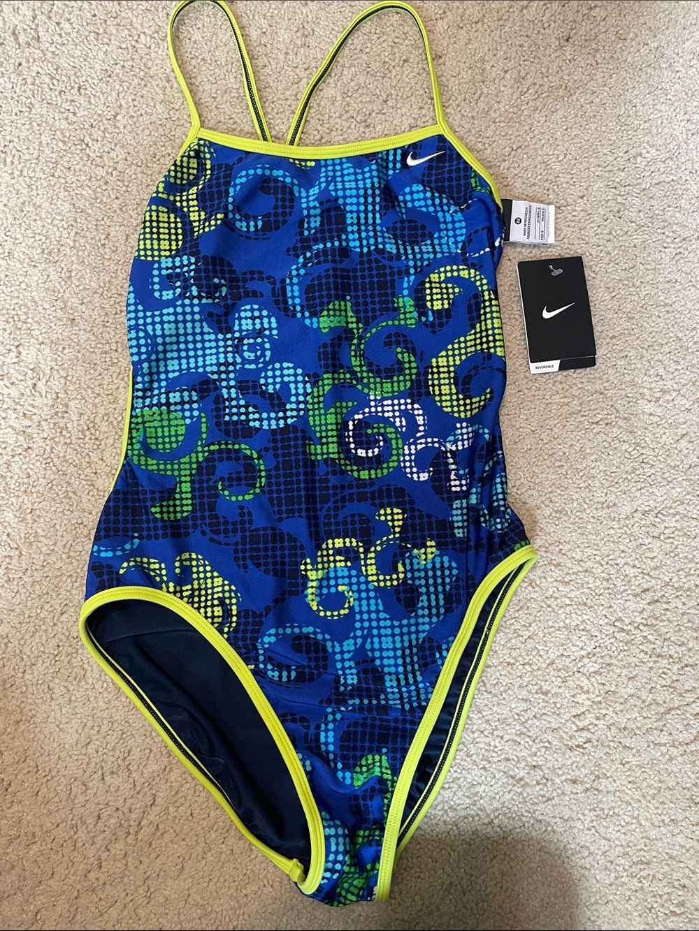 Nike Blue & Green Patterned One-Piece with Neon Trim
Reversible to solid navy